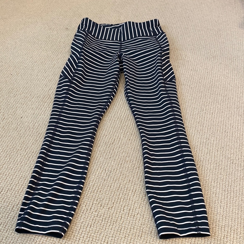Athleta small navy white pants , side pockets w zipper